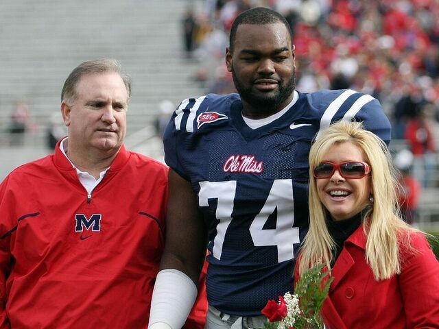 OXFORD, MS - NOVEMBER 28: Michael Oher #74 of the Ole Miss Rebels stands with his family during senior ceremonies prior to a game against the Mississippi State Bulldogs at Vaught-Hemingway Stadium on November 28, 2008 in Oxford, Mississippi.