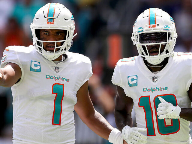 MIAMI GARDENS, FLORIDA - SEPTEMBER 25: Tua Tagovailoa #1 and Tyreek Hill #10 of the Miami Dolphins in action during the first half of the game against the Buffalo Bills at Hard Rock Stadium on September 25, 2022 in Miami Gardens, Florida.