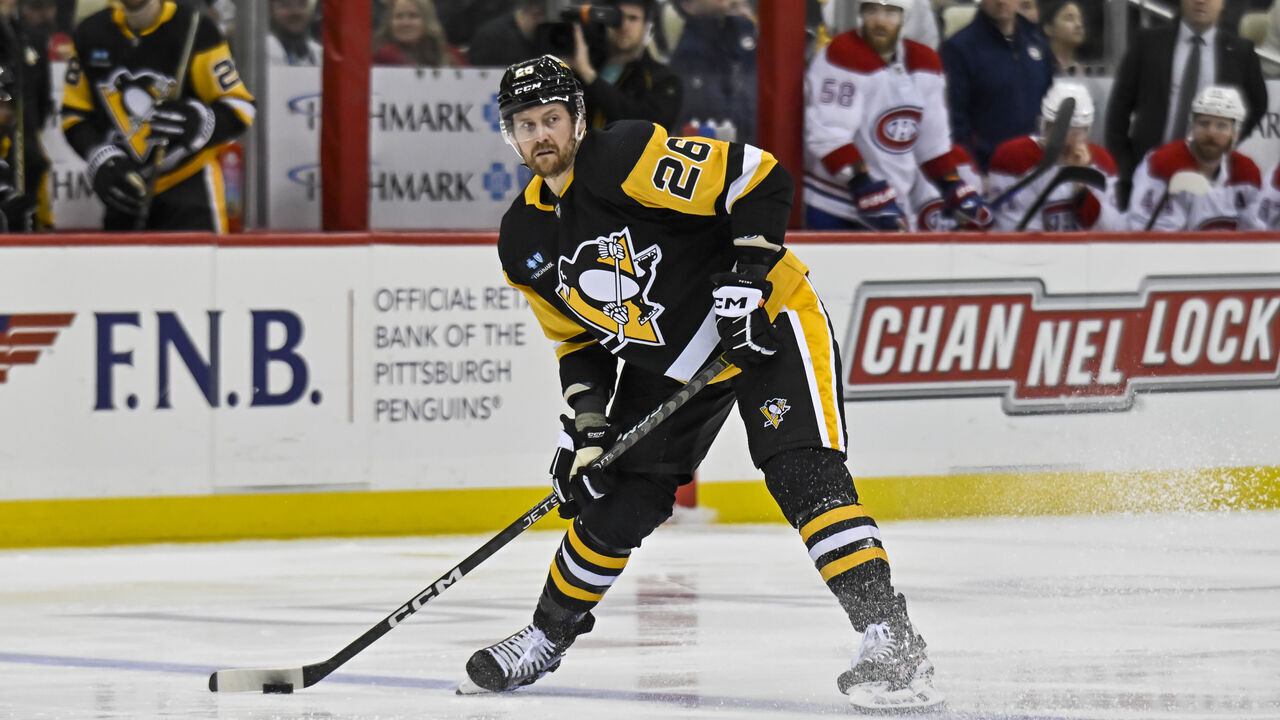 PITTSBURGH, PA - MARCH 14: Pittsburgh Penguins Defenseman Jeff Petry (26) passes the puck during the second period in the NHL game between the Pittsburgh Penguins and the Montreal Canadiens on March 14, 2023, at PPG Paints Arena in Pittsburgh, PA.