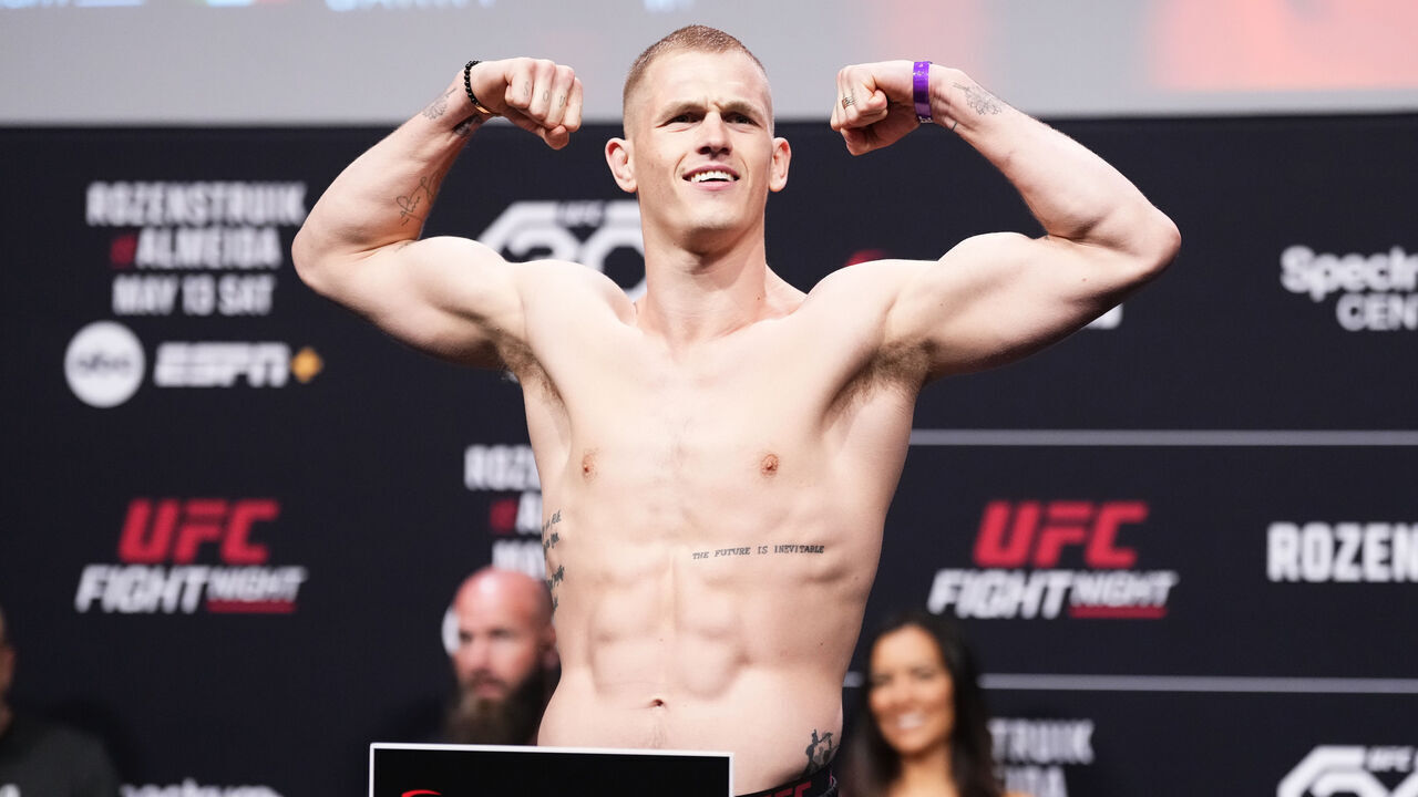 CHARLOTTE, NORTH CAROLINA - MAY 12: Ian Garry of Ireland poses on the scale during the UFC Fight Night ceremonial weigh-in at Spectrum Center on May 12, 2023 in Charlotte, North Carolina.