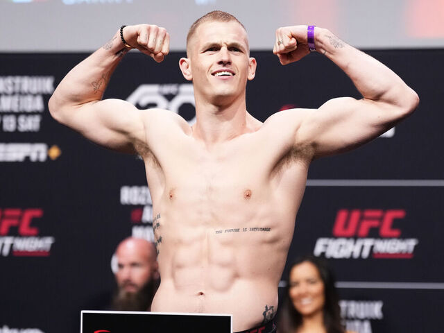 CHARLOTTE, NORTH CAROLINA - MAY 12: Ian Garry of Ireland poses on the scale during the UFC Fight Night ceremonial weigh-in at Spectrum Center on May 12, 2023 in Charlotte, North Carolina.