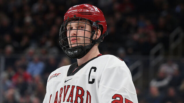 BOSTON, MA - FEBRUARY 13: Harvard Crimson forward John Farinacci (25) looks on during the Dunkin' Beanpot championship game between the Harvard Crimson and the Northeastern Huskies on February 13, 2023, at TD Garden in Boston, MA.