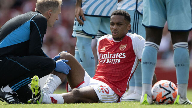LONDON, ENGLAND - AUGUST 12: Jurrien Timber of Arsenal receives treatment from Arsenal medical staff during the Premier League match between Arsenal FC and Nottingham Forest at Emirates Stadium on August 12, 2023 in London, England.
