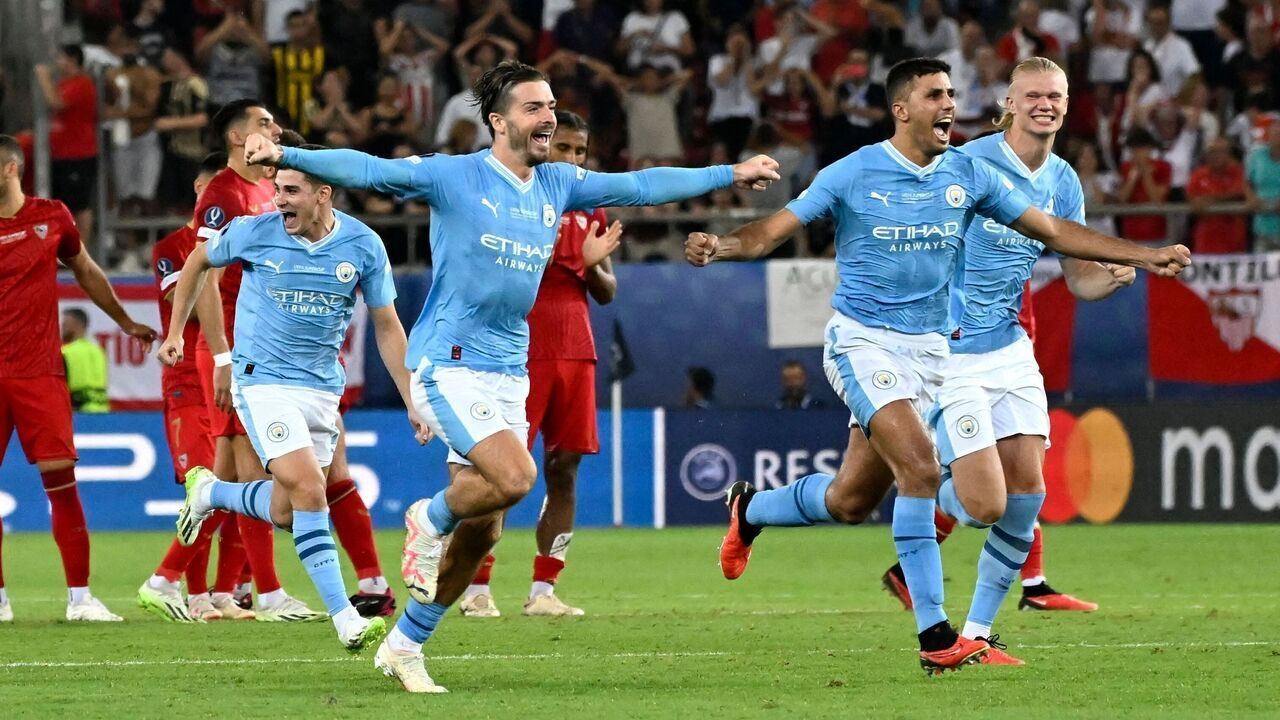 Manchester City's players celebrate victory after the penalty shootout of the 2023 UEFA Super Cup football match between Manchester City and Sevilla at the Georgios Karaiskakis Stadium in Piraeus on August 16, 2023.