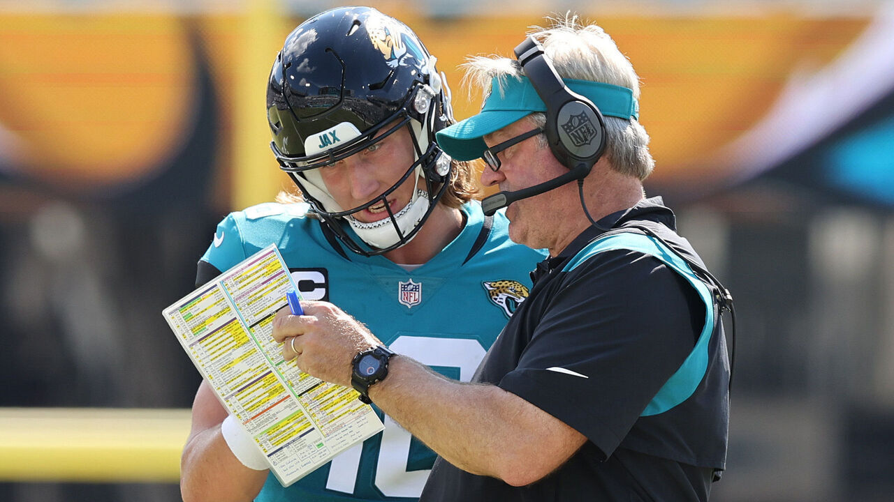 JACKSONVILLE, FLORIDA - OCTOBER 09: Head coach Doug Pederson of the Jacksonville Jaguars discusses a play with Trevor Lawrence #16 during the first half of the game against the Houston Texans at TIAA Bank Field on October 09, 2022 in Jacksonville, Florida.