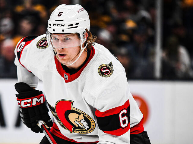 BOSTON, MASSACHUSETTS - MARCH 21: Jakob Chychrun #6 of the Ottawa Senators stands in position before a face-off in the third period against the Boston Bruins at TD Garden on March 21, 2023 in Boston, Massachusetts.