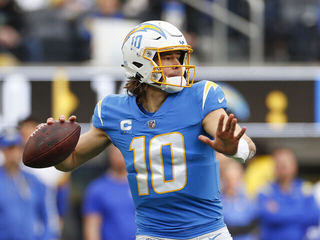 INGLEWOOD, CA - JANUARY 01: Los Angeles Chargers quarterback Justin Herbert (10) passes the ball during an NFL regular season game between the Los Angeles Rams and the Los Angeles Chargers on January 01, 2023, at SoFi Stadium in Inglewood, CA.