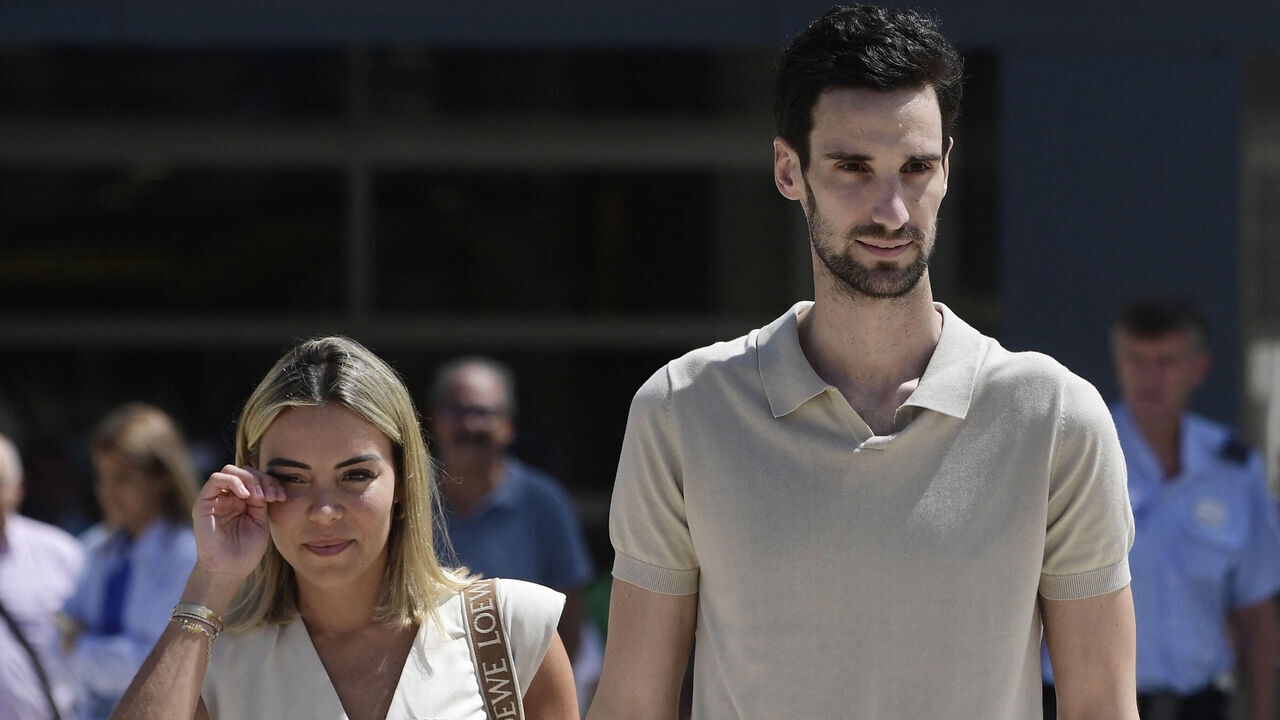 PSG Spanish goalkeeper Sergio Rico leaves the hospital with his wife Alba Silva (L), in Seville on August 18, 2023. PSG goalkeeper Sergio Rico, 29, was discharged today after receiving treatment at the Virgen del Rocio hospital in Seville, where he was admitted on May 28 after an accident involving a horse at a local festival.