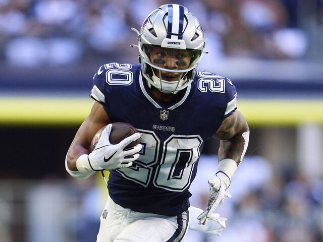 ARLINGTON, TX - OCTOBER 30: Tony Pollard #20 of the Dallas Cowboys runs with the ball against the Chicago Bears during the first half at AT&T Stadium on October 30, 2022 in Arlington, Texas.