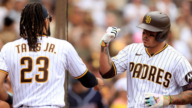 SAN DIEGO, CALIFORNIA - AUGUST 19: Fernando Tatis Jr. #23 congratulates Manny Machado #13 of the San Diego Padres after his solo homerun during the eighth inning of a game against the Arizona Diamondbacks at PETCO Park on August 19, 2023 in San Diego, California.