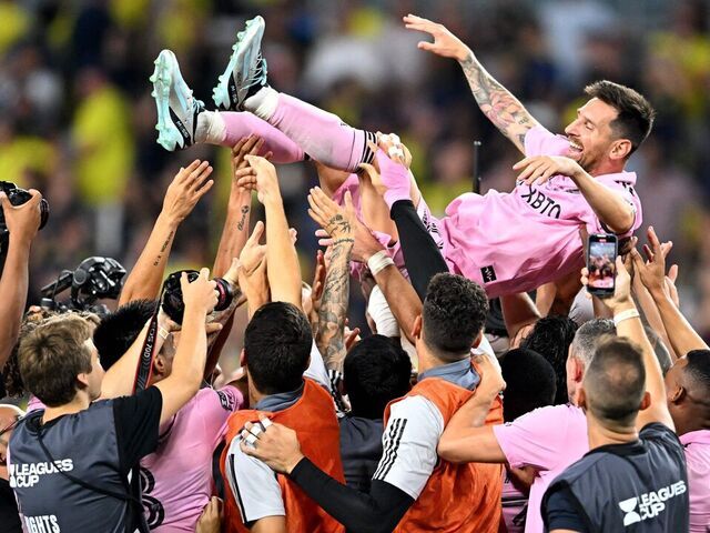 Teammates hold up Inter Miami's Argentine forward #10 Lionel Messi as they celebrate after winning the the Leagues Cup final football match against Nashville SC at Geodis Park in Nashville, Tennessee, on August 19, 2023.