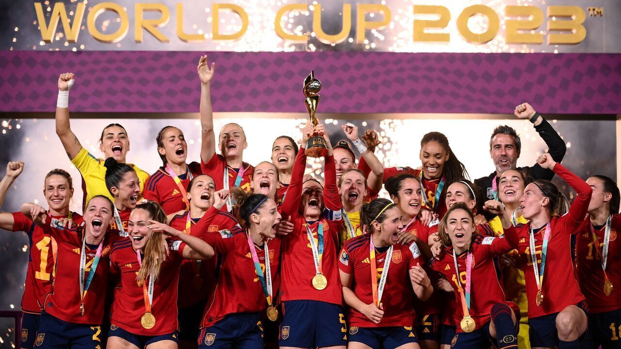 Spain's players celebrate with the trophy after winning the Australia and New Zealand 2023 Women's World Cup final football match between Spain and England at Stadium Australia in Sydney on August 20, 2023.
