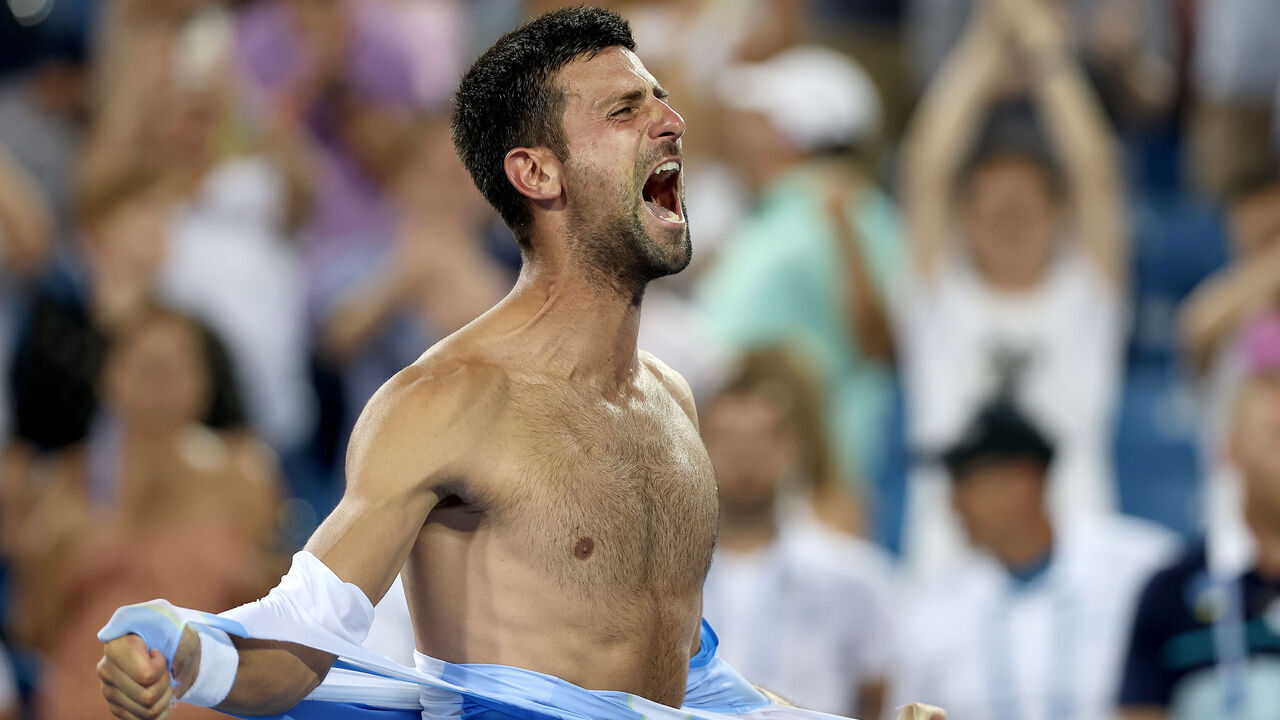 MASON, OHIO - AUGUST 20: Novak Djokovic of Serbia tears his shirt off after defeating Carlos Alcaraz of Spain during the final of the Western & Southern Open at Lindner Family Tennis Center on August 20, 2023 in Mason, Ohio.