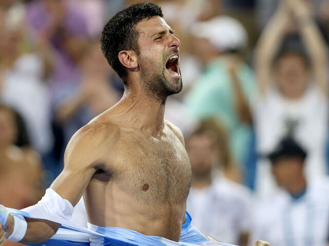 MASON, OHIO - AUGUST 20: Novak Djokovic of Serbia tears his shirt off after defeating Carlos Alcaraz of Spain during the final of the Western & Southern Open at Lindner Family Tennis Center on August 20, 2023 in Mason, Ohio.
