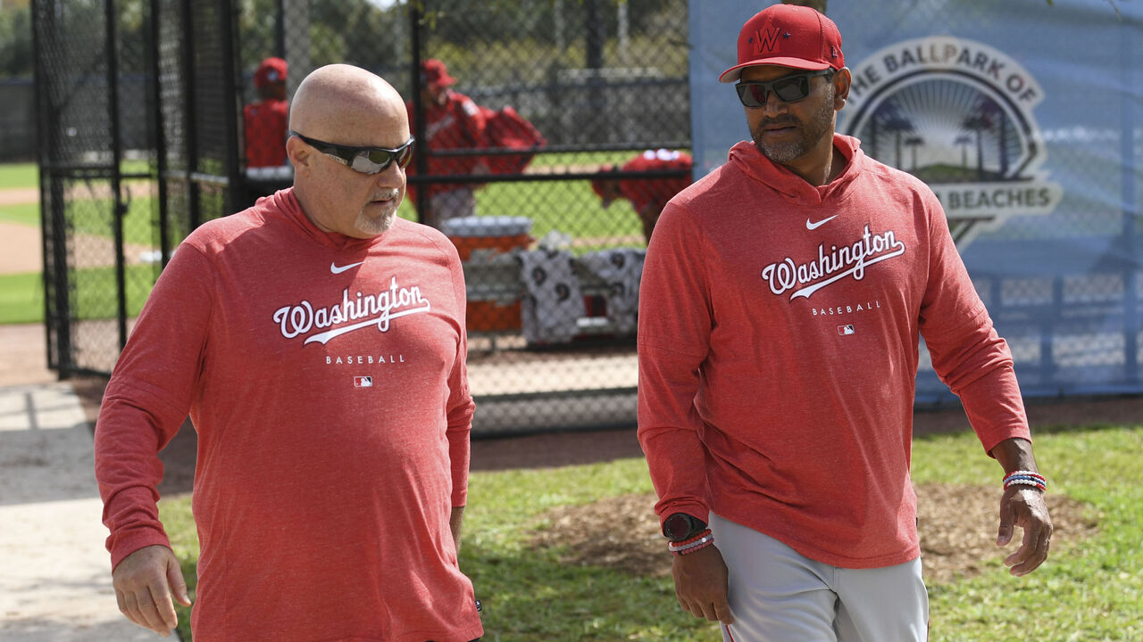 WEST PALM BEACH, FL - FEBRUARY 18: Washington Nationals president and general manager Mike Rizzo walks with manager Dave Martinez (4) during spring training workouts at the training complex on February 18, 2023.