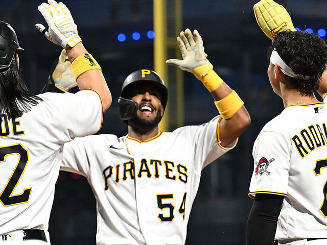 PITTSBURGH, PENNSYLVANIA - AUGUST 21: Joshua Palacios #54 of the Pittsburgh Pirates celebrates with Connor Joe #2 and Endy Rodriguez #25 after hitting a three run home run in the fourth inning during the game against the St. Louis Cardinals at PNC Park on August 21, 2023 in Pittsburgh, Pennsylvania.