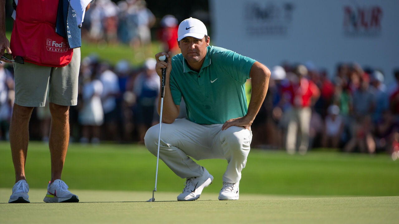 ATLANTA, GA - AUGUST 28: Scottie Scheffler (USA) lining up his putt on the 15th green during the final round of the PGA TOUR Championship on August 28, 2022 at East Lake Golf Club in Atlanta, GA.