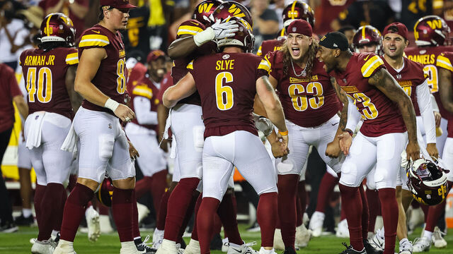 LANDOVER, MD - AUGUST 21: Joey Slye #6 of the Washington Commanders celebrates with teammates after kicking the go-ahead field goal against the Baltimore Ravens during the second half of the preseason game at FedExField on August 21, 2023 in Landover, Maryland.