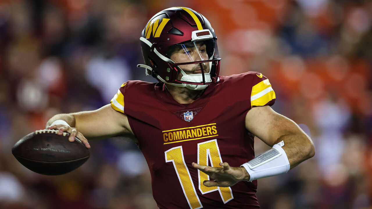 LANDOVER, MD - AUGUST 21: Sam Howell #14 of the Washington Commanders attempts a pass against the Baltimore Ravens during the first half of the preseason game at FedExField on August 21, 2023 in Landover, Maryland.