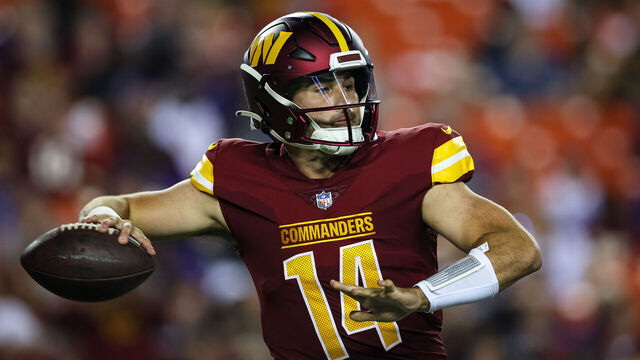 LANDOVER, MD - AUGUST 21: Sam Howell #14 of the Washington Commanders attempts a pass against the Baltimore Ravens during the first half of the preseason game at FedExField on August 21, 2023 in Landover, Maryland.