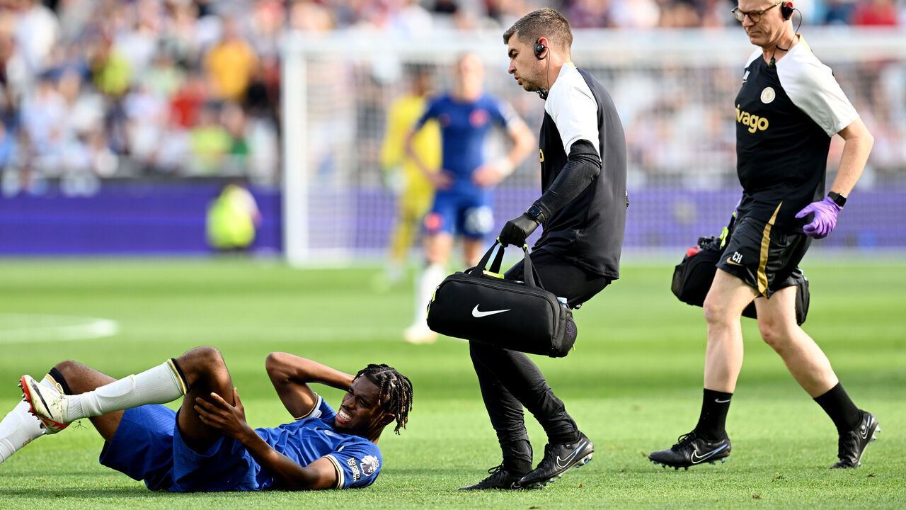 LONDON, ENGLAND - AUGUST 20: Carney Chukwuemeka of Chelsea goes down with an injury during the Premier League match between West Ham United and Chelsea FC at London Stadium on August 20, 2023 in London, England.