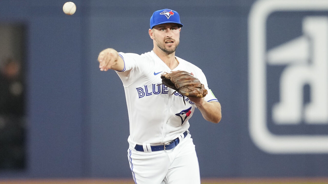 TORONTO, ON - AUGUST 15: Paul DeJong #10 of Toronto Blue Jays fields a ball against the Philadelphia Phillies during the seventh inning in their MLB game at the Rogers Centre on August 15, 2023 in Toronto, Ontario, Canada.