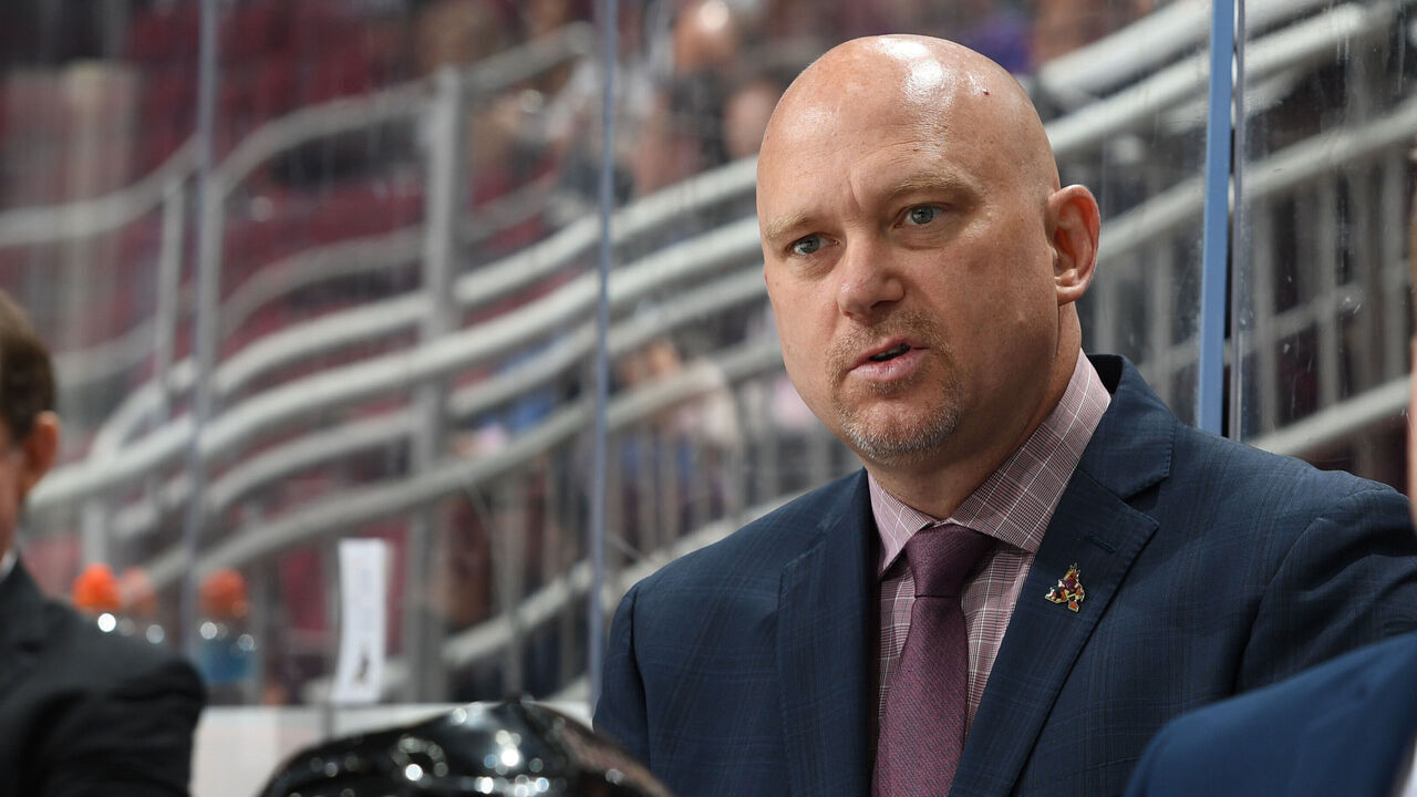 GLENDALE, ARIZONA - SEPTEMBER 27: Head coach Andre' Tourigny of the Arizona Coyotes looks on from the bench during a preseason game against the Los Angeles Kings at Gila River Arena on September 27, 2021 in Glendale, Arizona.