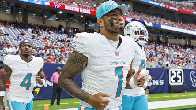 HOUSTON, TEXAS - AUGUST 19: Tua Tagovailoa #1 of the Miami Dolphins jogs onto the field before the preseason game against the Houston Texans at NRG Stadium on August 19, 2023 in Houston, Texas. The Dolphins defeated the Texans 28-3.