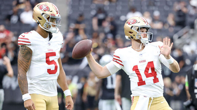 LAS VEGAS, NEVADA - AUGUST 13: Quarterback Trey Lance #5 of the San Francisco 49ers watches quarterback Sam Darnold #14 of the San Francisco 49ers during warmups against the Las Vegas Raiders during a preseason game at Allegiant Stadium on August 13, 2023 in Las Vegas, Nevada.