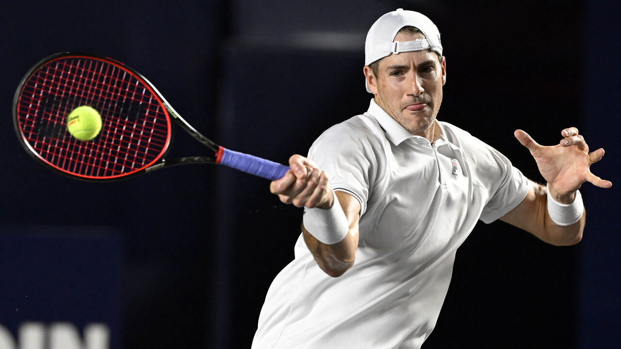 USA's John Isner plays a forehand return to Greece's Stefanos Tsitsipas during their Mexico ATP Open 250 men's singles round of 16 tennis match at Cabo Sports Complex in Los Cabos, Baja California, Mexico, on August 3, 2023.