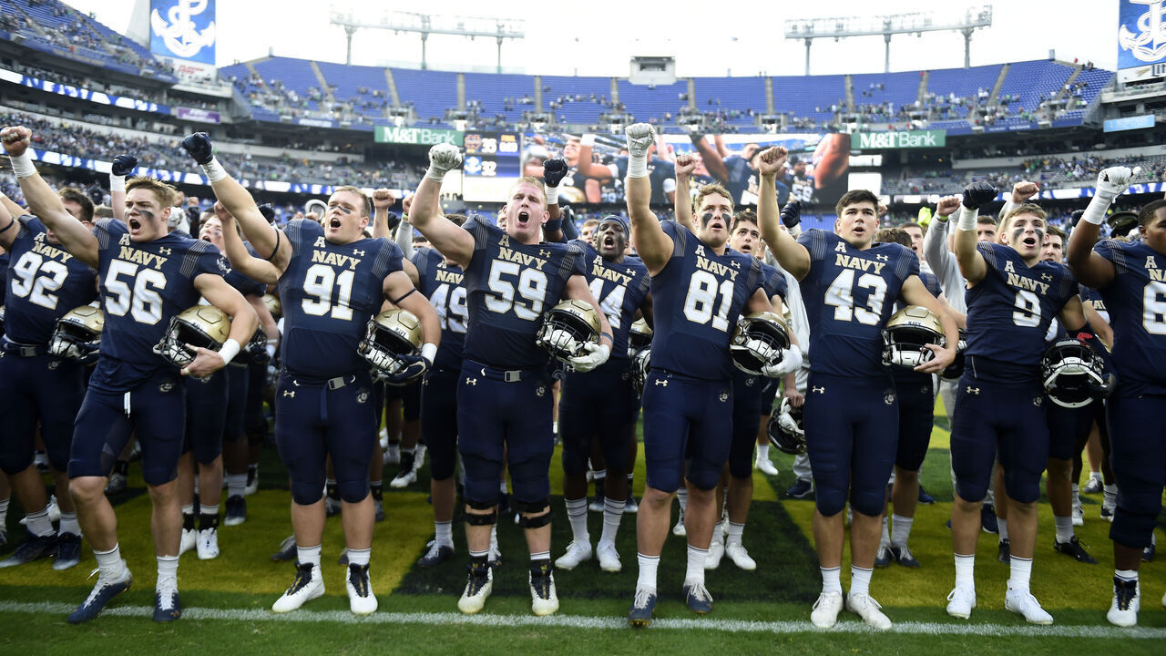 BALTIMORE, MARYLAND - NOVEMBER 12: The Navy Midshipmen sign to the crowd after the game against the Notre Dame Fighting Irish at M&T Bank Stadium on November 12, 2022 in Baltimore, Maryland.