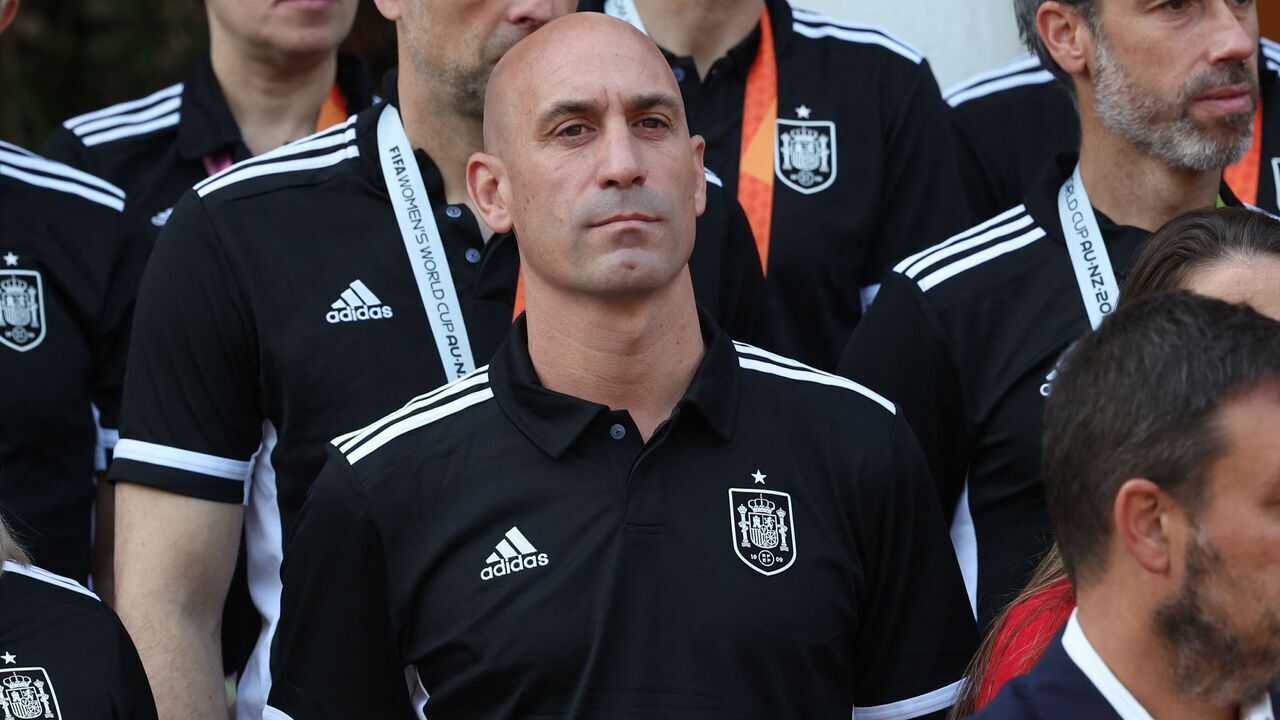 Spanish Royal Football Federation (RFEF) president Luis Rubiales (C) and Spain's coach Jorge Vilda (R) look on as Spain's acting Prime Minister receives Spain women's national football team's players after their 2023 World Cup victory at La Moncloa Palace in Madrid on August 22, 2023. Spain won the Australia and New Zealand 2023 Women's World Cup final football match after defeating England at Stadium Australia in Sydney on August 20, 2023.