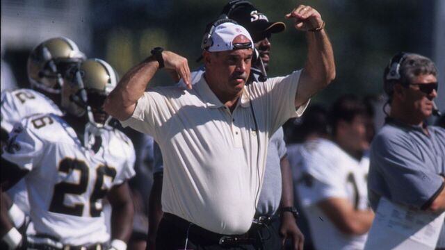 SEATTLE, WA - SEPTEMBER 17: Defensive coordinator Steve Sidwell of the New Orleans Saints signals a defensive scheme on the sideline against the Seattle Seahawks at Husky Stadium in Seattle, Washington on Septemtber 17, 2001. The Seahawks defeated the Saints 20-10.
