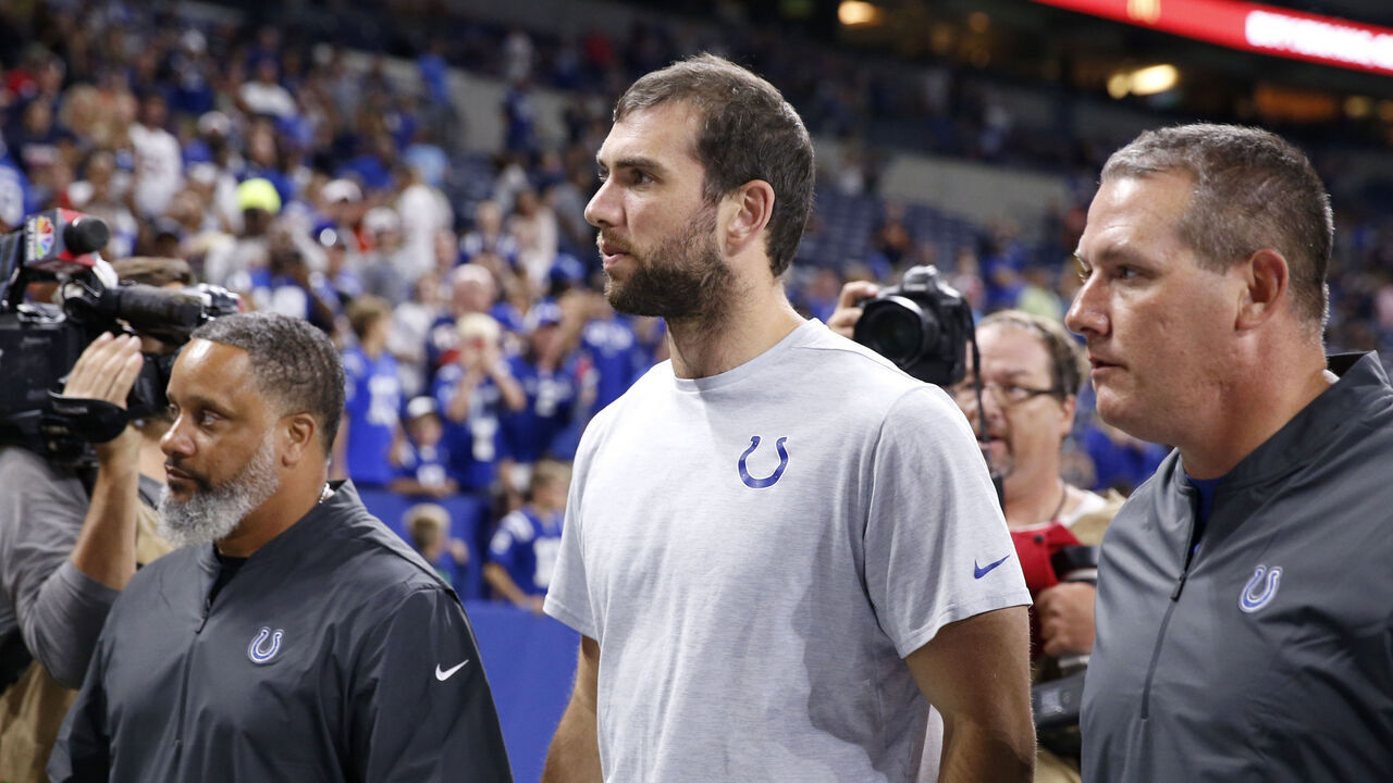 INDIANAPOLIS, INDIANA - AUGUST 24: Andrew Luck #12 of the Indianapolis Colts walks off the field after a report of his retirement after the Indianapolis Colts preseason game against the Chicago Bears at Lucas Oil Stadium on August 24, 2019 in Indianapolis, Indiana.