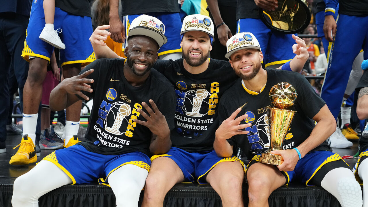 BOSTON, MA - JUNE 16: Draymond Green #23, Klay Thompson #11 and Stephen Curry #30 of the Golden State Warriors celebrate with the Bill Russell Finals MVP Trophy after winning during Game Six of the 2022 NBA Finals on June 16, 2022 at TD Garden in Boston, Massachusetts. NOTE TO USER: User expressly acknowledges and agrees that, by downloading and or using this photograph, user is consenting to the terms and conditions of Getty Images License Agreement. Mandatory Copyright Notice: Copyright 2022 NBAE