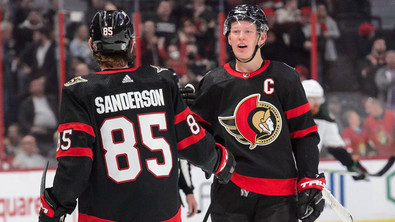 OTTAWA, CANADA - OCTOBER 22: Brady Tkachuk #7 of the Ottawa Senators celebrates with teammate Jake Sanderson #85 after scoring a third period goal on the Arizona Coyotes at Canadian Tire Centre on October 22, 2022 in Ottawa, Ontario, Canada.