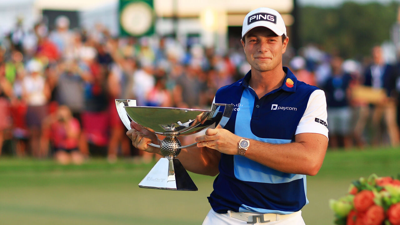 ATLANTA, GEORGIA - AUGUST 27: Viktor Hovland of Norway celebrates with the FedEx Cup after winning during the final round of the TOUR Championship at East Lake Golf Club on August 27, 2023 in Atlanta, Georgia.