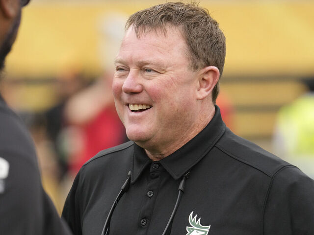 HAMILTON, CANADA - AUGUST 17: Head coach Chris Jones of the Edmonton Elks smiles before a game against the Hamilton Tiger-Cats at Tim Hortons Field on August 17, 2023 in Hamilton, Canada.