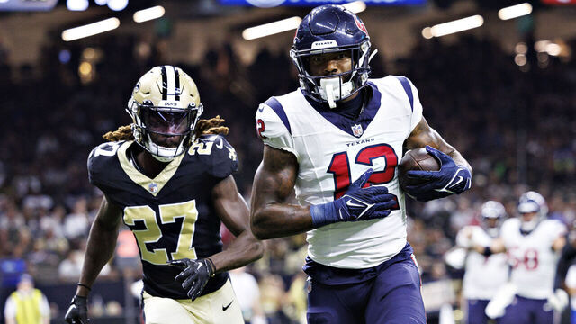 NEW ORLEANS, LOUISIANA - AUGUST 27: Nico Collins #12 of the Houston Texans catches a pass for a touchdown during the preseason game against the New Orleans Saints at Caesars Superdome on August 27, 2023 in New Orleans, Louisiana.