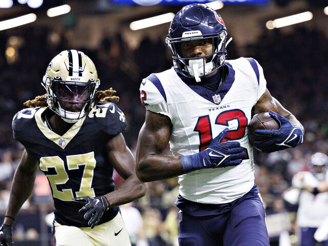 NEW ORLEANS, LOUISIANA - AUGUST 27: Nico Collins #12 of the Houston Texans catches a pass for a touchdown during the preseason game against the New Orleans Saints at Caesars Superdome on August 27, 2023 in New Orleans, Louisiana.