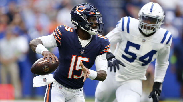 INDIANAPOLIS, IN - AUGUST 19: Chicago Bears quarterback PJ Walker (15) rolls out of the pocket during a preseason game between the Chicago Bears and the Indianapolis Colts on August 19, 2023 at Lucas Oil Stadium in Indianapolis, IN.