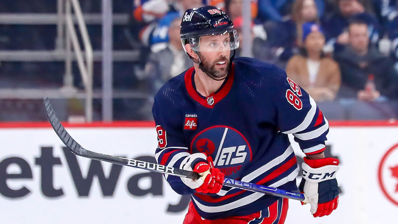 WINNIPEG, CANADA - FEBRUARY 26: Sam Gagner #89 of the Winnipeg Jets keeps an eye on the play during third period action against the New York Islanders at the Canada Life Centre on February 26, 2023 in Winnipeg, Manitoba, Canada. The Isles shutout the Jets 4-0.