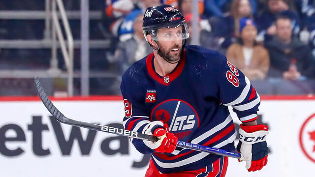 WINNIPEG, CANADA - FEBRUARY 26: Sam Gagner #89 of the Winnipeg Jets keeps an eye on the play during third period action against the New York Islanders at the Canada Life Centre on February 26, 2023 in Winnipeg, Manitoba, Canada. The Isles shutout the Jets 4-0.