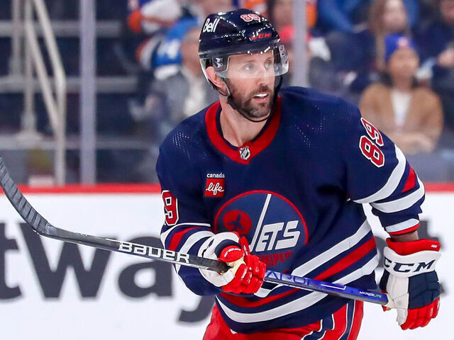 WINNIPEG, CANADA - FEBRUARY 26: Sam Gagner #89 of the Winnipeg Jets keeps an eye on the play during third period action against the New York Islanders at the Canada Life Centre on February 26, 2023 in Winnipeg, Manitoba, Canada. The Isles shutout the Jets 4-0.