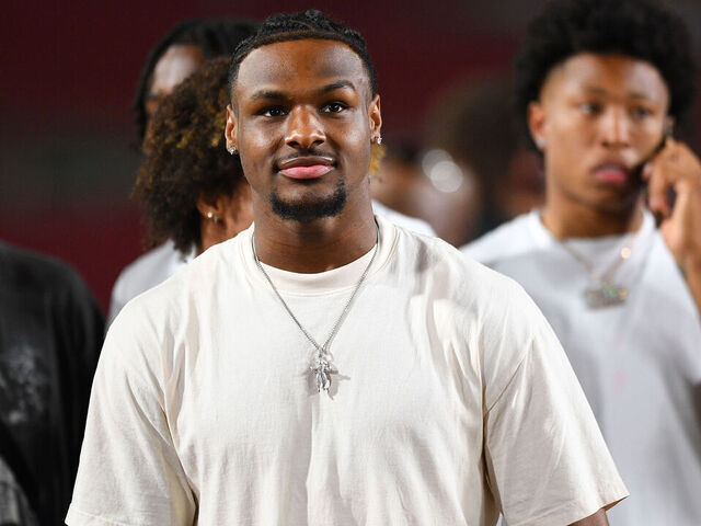 LOS ANGELES, CA - AUGUST 26: USC basketball player Bronny James looks on during a game between the San Jose State Spartans and the USC Trojans on August 26, 2023, at Los Angeles Memorial Coliseum in Los Angeles, CA.