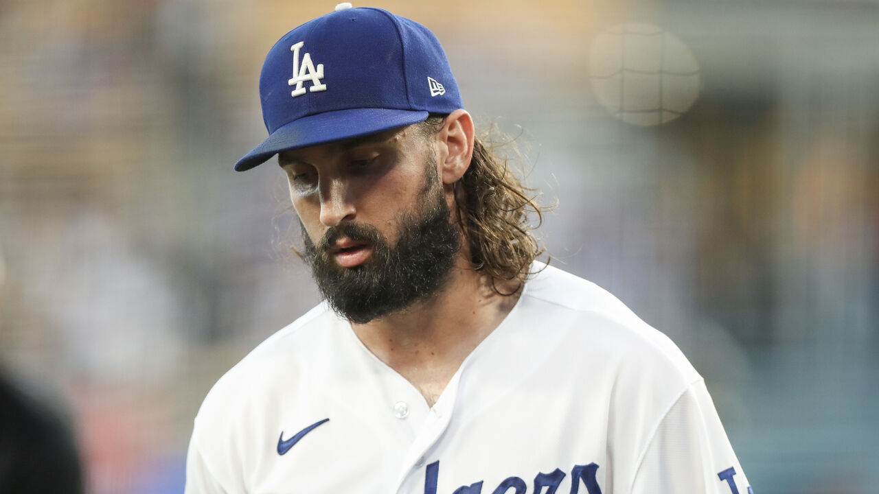 LOS ANGELES, CALIFORNIA - AUGUST 18: Tony Gonsolin #26 of the Los Angeles Dodgers comes in from the pitching mound after the first inning against the Miami Marlins at Dodger Stadium on August 18, 2023 in Los Angeles, California.