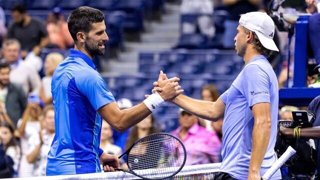 Serbia's Novak Djokovic (L) greets France's Alexandre Muller at the net following Djokovic's victory during the US Open tennis tournament men's singles first round match at the USTA Billie Jean King National Tennis Center in New York City, on August 28, 2023.