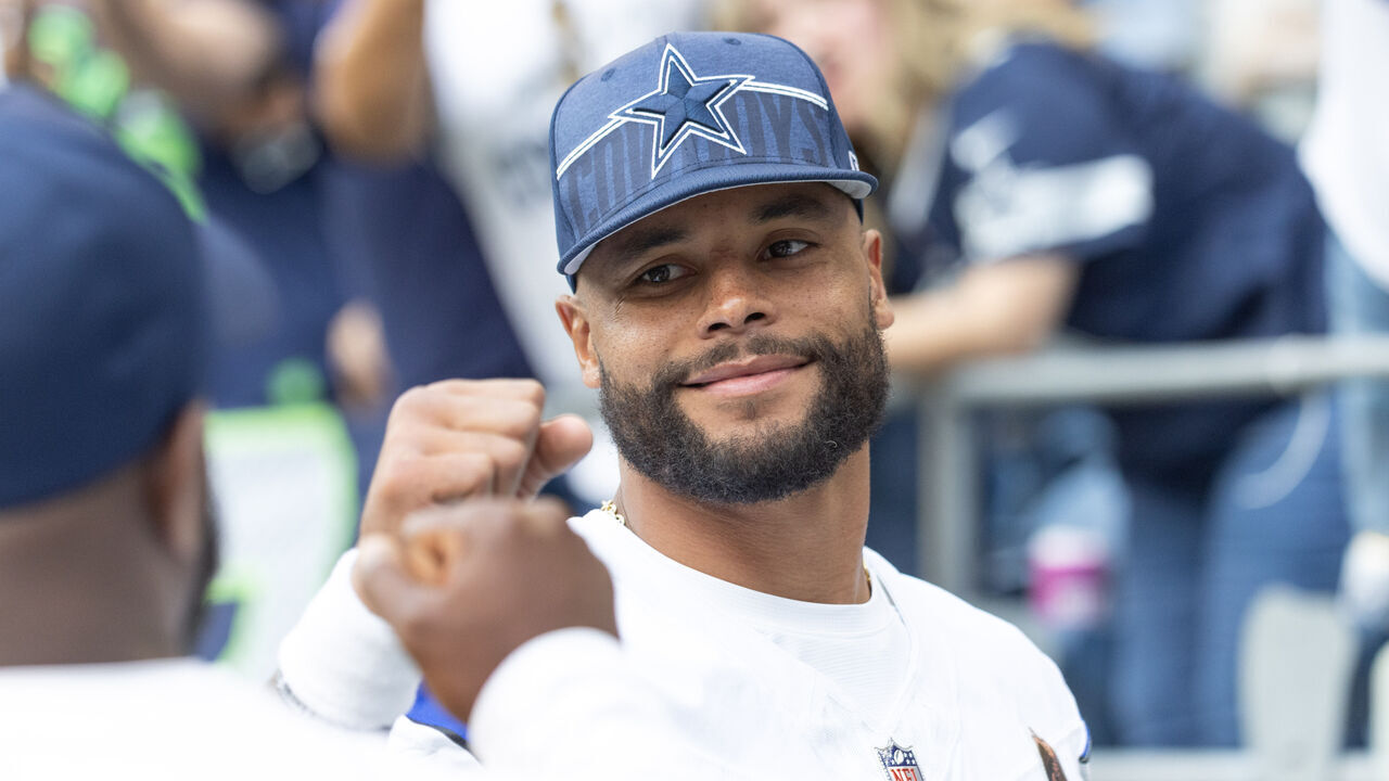 SEATTLE, WASHINGTON - AUGUST 19: Dak Prescott #4 of the Dallas Cowboys cheers teammates on before their preseason game against the Seattle Seahawks at Lumen Field on August 19, 2023 in Seattle, Washington.