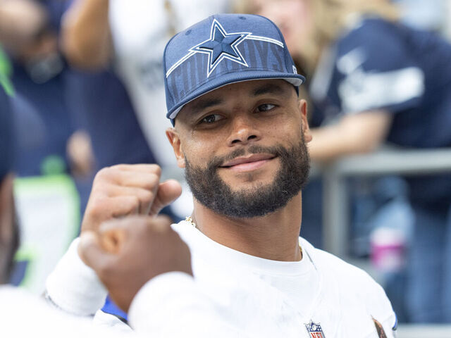 SEATTLE, WASHINGTON - AUGUST 19: Dak Prescott #4 of the Dallas Cowboys cheers teammates on before their preseason game against the Seattle Seahawks at Lumen Field on August 19, 2023 in Seattle, Washington.