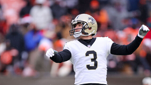 CLEVELAND, OH - DECEMBER 24: New Orleans Saints place kicker Wil Lutz (3) kicks an extra point out of the hold of New Orleans Saints punter Blake Gillikin (4) during the third quarter of the National Football League game between the New Orleans Saints and Cleveland Browns on December 24, 2022, at FirstEnergy Stadium in Cleveland, OH.